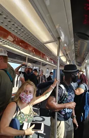 no mask policy in Dallas DFW airport despite packed Skytrain
