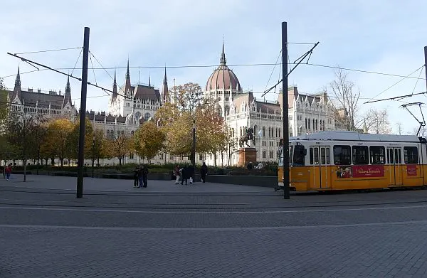 city tram going by the Parliament building